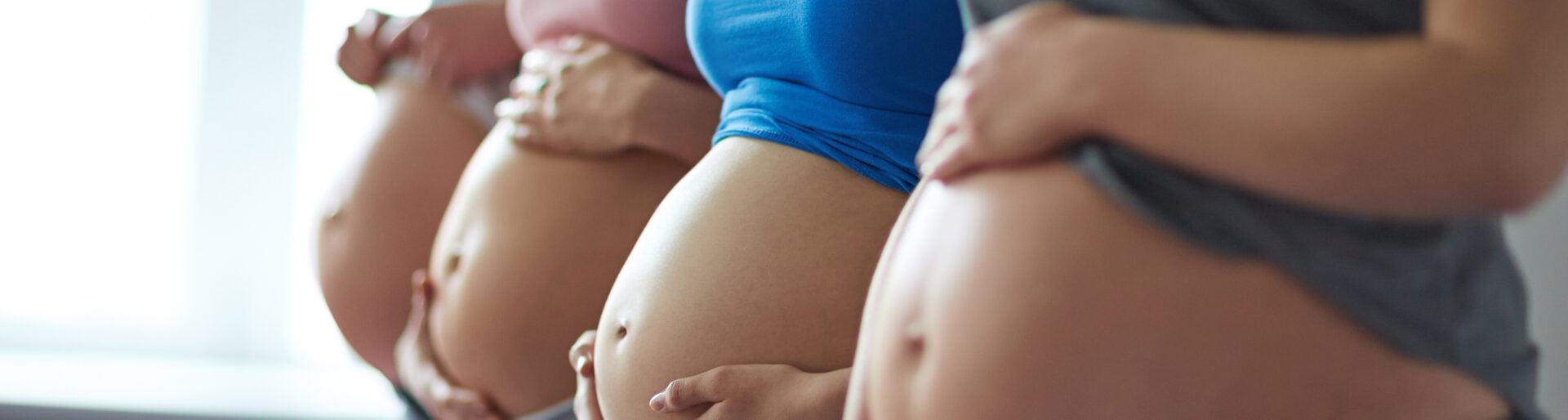 Row of pregnant women